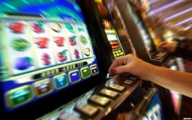 Push Gaming slot interface on boomslot showing five-reel layout with feature symbols and stake controls